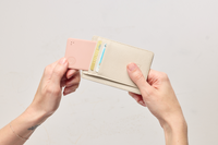 Image of a Tile- Slim Blush being put into a wallet