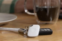 Image of a Tile Pro- White attached to a keychain
