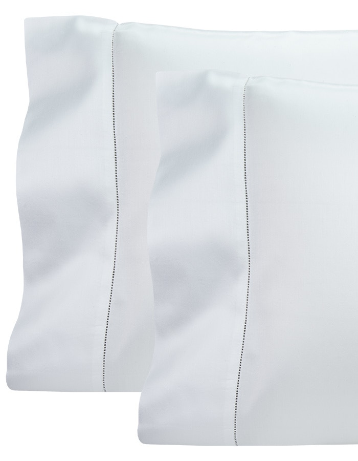 Produced in Italy from 100% long staple cotton. Woven in a solid sateen. Finished with an elegant hemstitch detail.