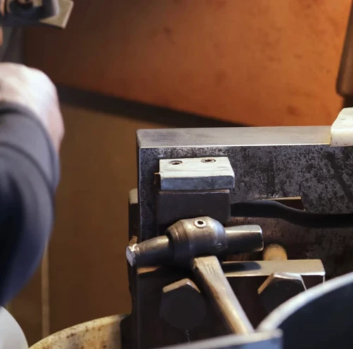 a picture of a blades smiths hammer and work area