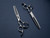 silver left handed scissors with black "N" logo and 14 teeth on one blade on a blue background