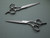 silver colored right handed hair scissor with black "N" logo  on a dark background