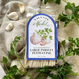Garlic Parsley Fettuccine - A bundle of golden fettuccine ribbons flecked with green parsley and garlic specks. Wrapped in transparent packaging with a rustic label, it showcases its handmade quality and rich, savory aroma. A visual promise of a flavorful, easy-to-cook dish. Garlic Parsley Fettuccine - A bundle of golden fettuccine ribbons flecked with green parsley and garlic specks. Wrapped in transparent packaging with a rustic label, it showcases its handmade quality and rich, savory aroma. A visual promise of a flavorful, easy-to-cook dish.