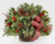 Whether you're welcoming your family home or sharing a gift filled with natural cheer, our Holiday Homecomings Basket is the perfect arrangement to do so. A lush collection of assorted Christmas greens, seeded eucalyptus and holly come together a rustic wooden basket. Accented by a red and green ribbon, pinecone pics and metallic berry pics, this arrangement adds a touch of charm to wherever its placed.  Also, it will last thru the entire holiday season!