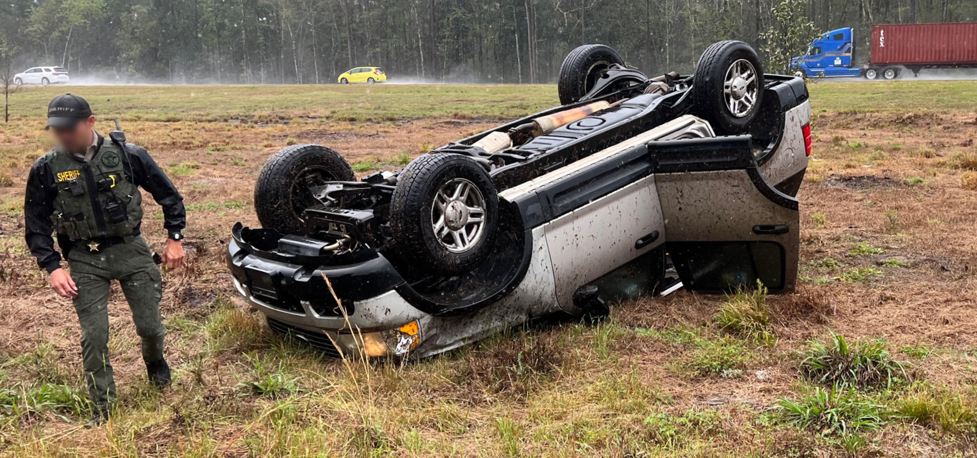 Car flipped over in highway accident at the scene