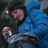 SureFire G2X Pro flashlight used outdoors checking backpack in low light