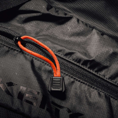 Exotac TinderZIP waterproof emergency tinder with zipper attachment and quick ignition core.