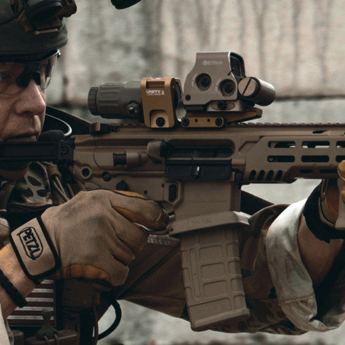 Unity Tactical Optics Riser mounted on rifle with holographic sight and magnifier in use