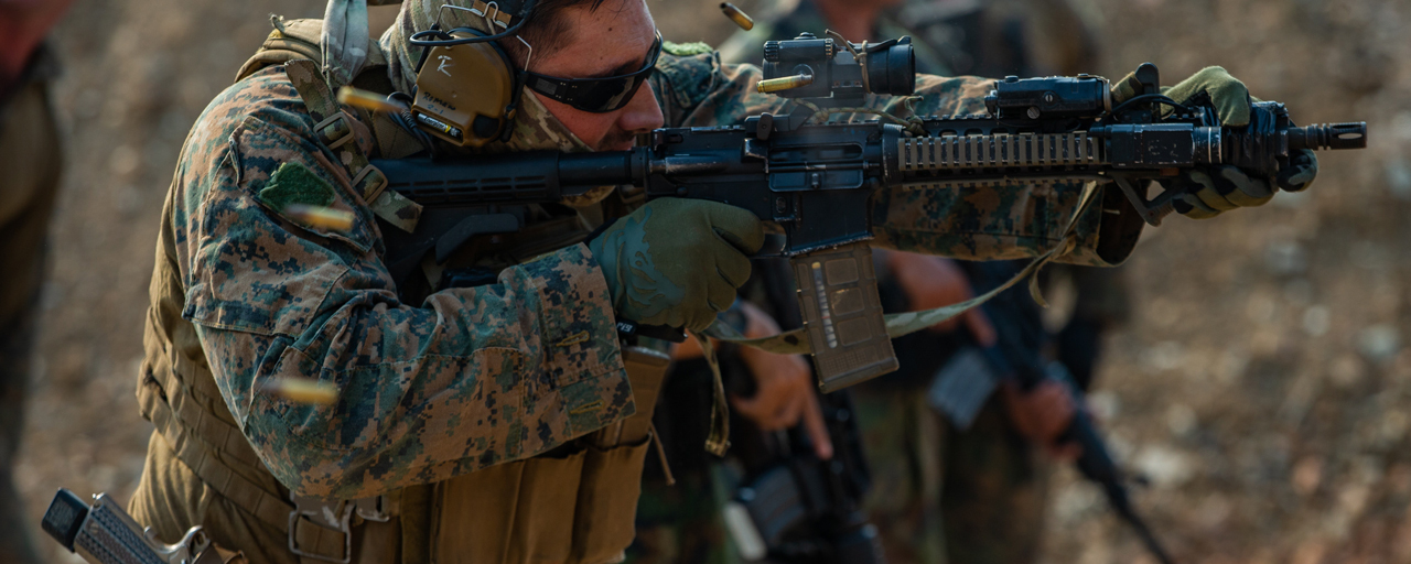 Department of War Photo showing Ten-Speed Triple M4 Mag Pouch use from Blue Force Gear