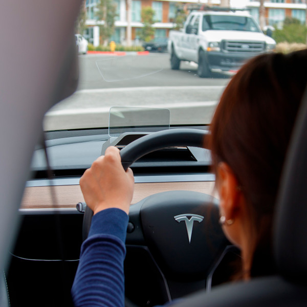 Driving in Tesla Model 3 with heads-up display