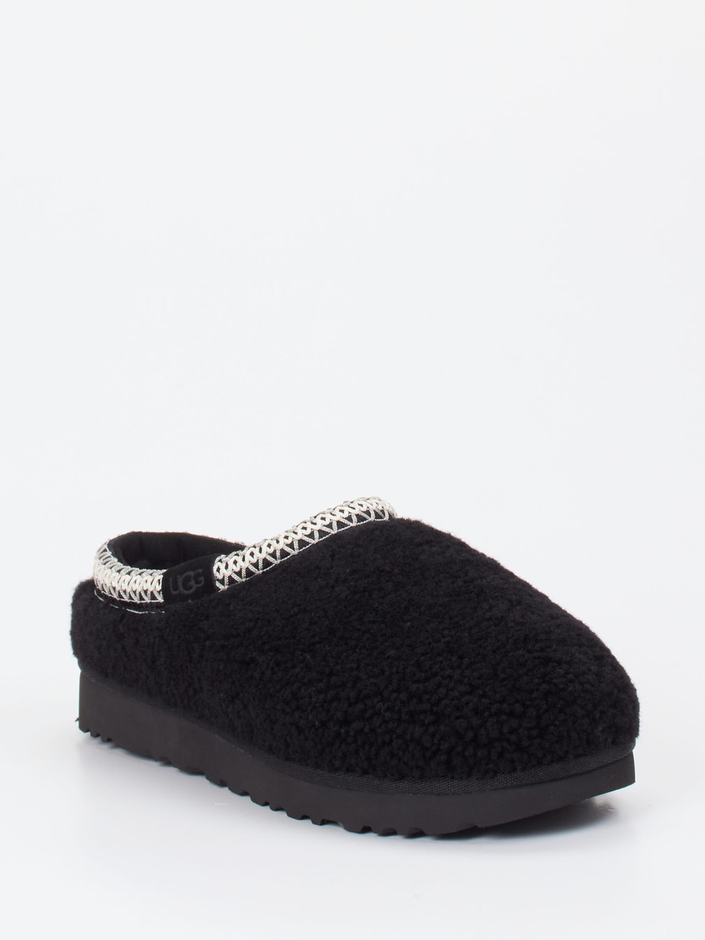 UGG – Hausschuh aus Fell in Schwarz mit Bouclé