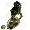 half nude sexy and seductive mermaid figurine coming out of the water