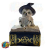 A snow owl figurine donning a witch's hat, perched atop a spell book, crafted as a small jewelry trinket box.