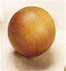 A 2" wooden ball sitting on a table.