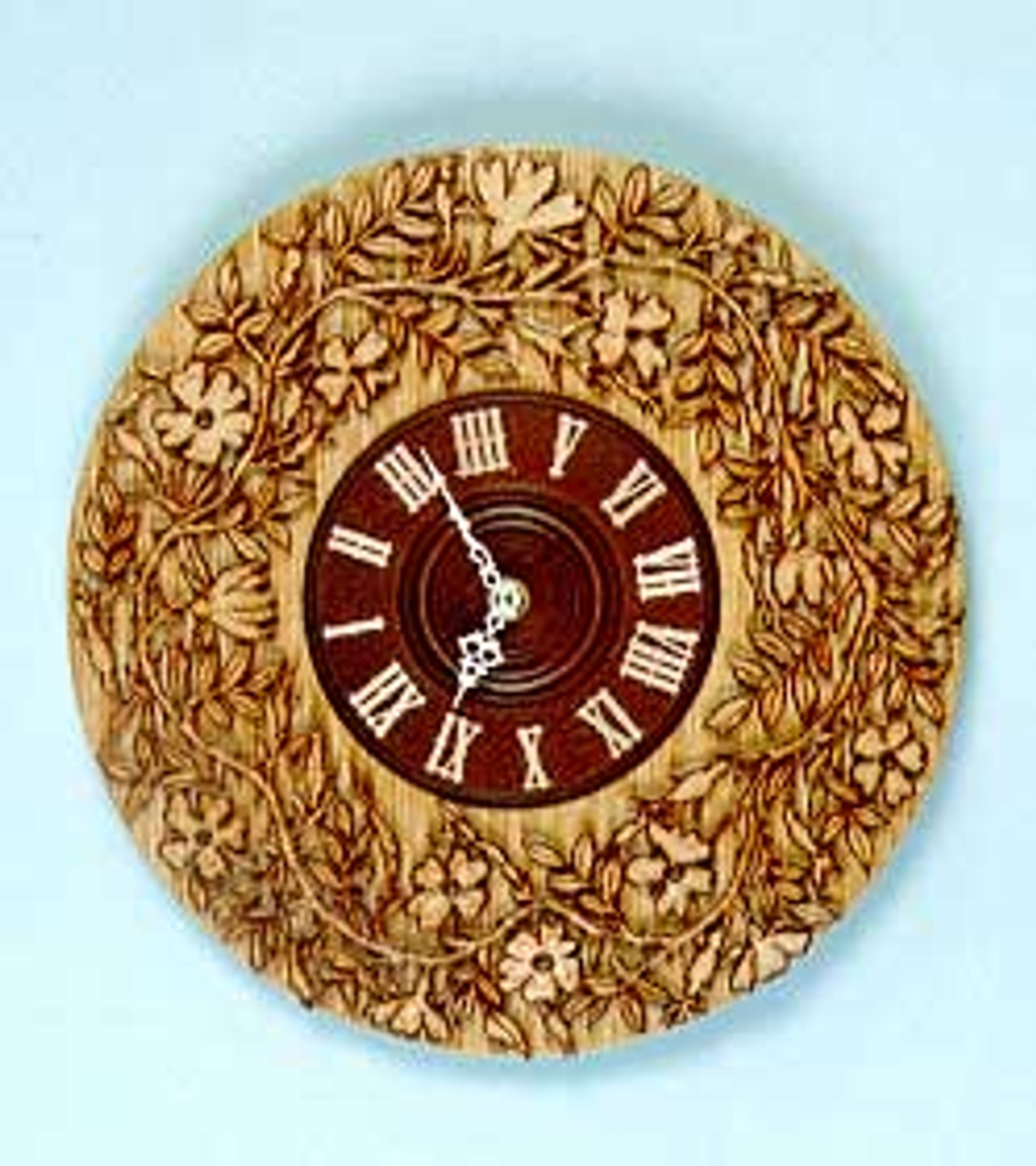 This completed scroll sawn piece is from the Vine Clock Scroll Saw Pattern. It is featured with great detail in the leafs and vines by wood burning around the vines and leaves. 