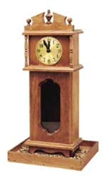 The Dinnertime Birdfeeder  is shown after it has been built with finials on top, a clock with a gold metal dial, and the bottom is holding the bird food.