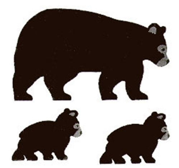 This is a photo of the finished cut outs showing three black bears walking.  A mother and two cubs in silhouette style