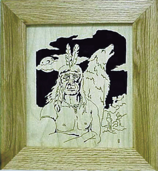Finished cut out  on Oak of the Native American with feathers in his hair and a howling wolf behind him.
