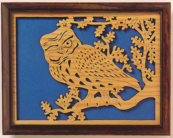Looking at a scroll saw project with an Owl in a tree.