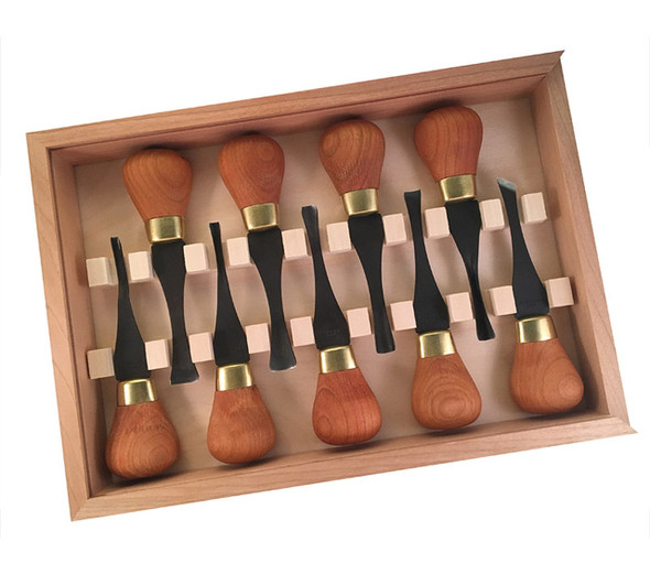 The carving tool case is open and showing the cherry handles, brass ferrules and carving gouge blades of the Flexcut Premium Deluxe Palm Set.