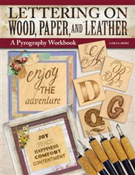 The cover for the book lettering on wood, paper and leather.