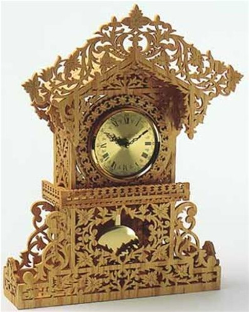 A built scroll saw clock with a pendulum movement and a gold dial using the Queens Clock Scroll Saw Plan.