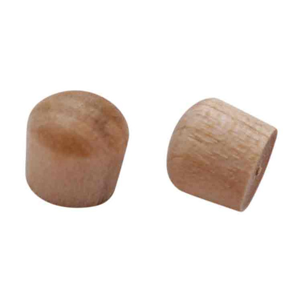 A closeup of wood plugs that are rounded.