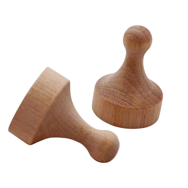 A pair of wooden game pawns.