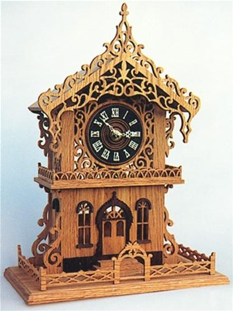 This is a finished scroll saw clock with a wooden cuckoo dial using the Cottage Clock Scroll Saw Plan.