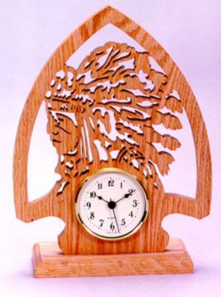 A finished piece of cherry with the Arrowhead Clock scroll saw pattern cut out.
