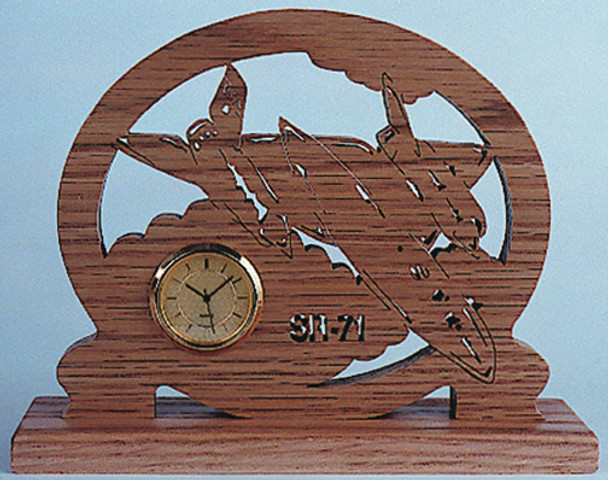 Finished piece of Walnut with the Blackbird SR-71 Plane Clock scroll saw cut out.