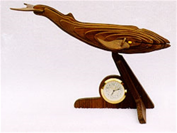 The Blue Whale is cut out in layered pieces resting on a stand with a small clock insert below it's belly.