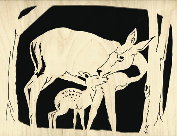 Finished cut out on a piece of oak with a doe leaning over and kissing her fawn while hidden in the forest under a tree.