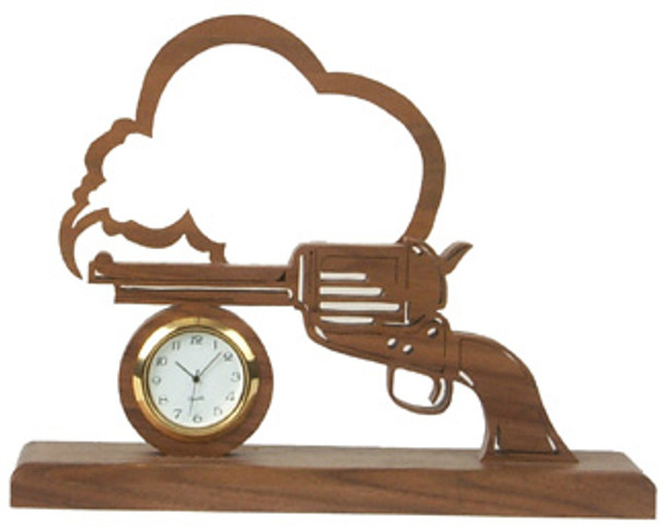 A scroll saw cutout of Smoking Gun Clock with a cloud above the gun and a clock insert below the barrel.