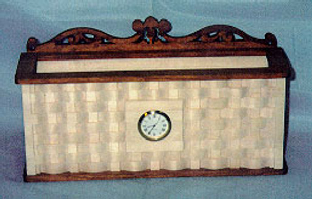 The scroll saw wall basket clock pattern is from Wildwood Designs features a basket weave design with a clock or photo frame in the center. 