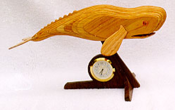Whale with a clock underneath mounted to a stand. Scroll saw the Whale pattern using layers of wood. 