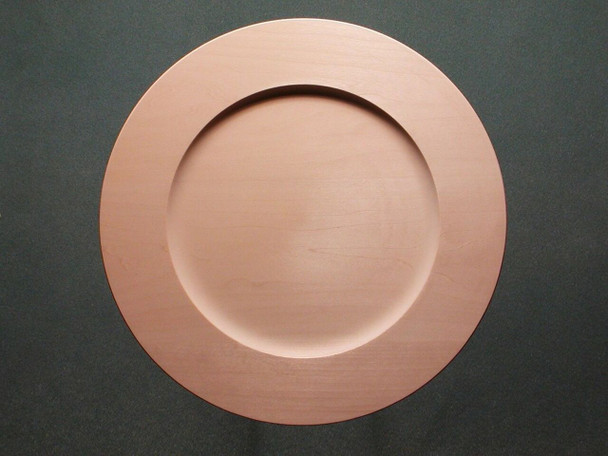 A basswood plate with a flat outside rim and a slight dishing of the center of the plate.