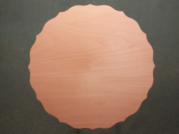 A scalloped edge on a flat basswood plate.