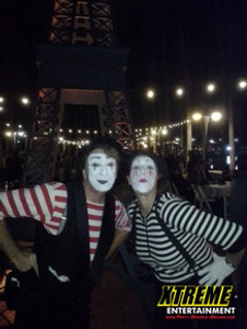 "Professional mime performer entertaining guests at a corporate event with silent comedy"