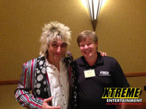 "Professional Rod Stewart Impersonator delivering a flawless tribute performance at a concert"