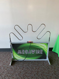 Mega Wire carnival game for rent — players guide a metal loop along a wire without touching it, perfect for parties, school fairs, and events.