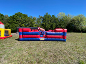 Last Man Standing inflatable game with rotating arms, where players jump and duck to avoid being knocked over — great for events and team challenges.