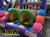 "Funhouse Super Obstacle Course with kids racing through colorful inflatable obstacles"
