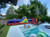 35ft Obstacle Challenge inflatable course for rent — a high-energy adventure with climbing walls, tunnels, and slides, ideal for school events and festivals.