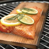 Salmon cooking on a Cedar Grilling Plank