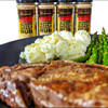 A steak with asparagus and potatoes, with Ultimate Steak and Roast Rub shakers