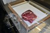 A piece of meat on the Damark MP-3 Shrink Tunnel