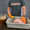 The Automatic Syringe Injector being used to inject a piece of meat