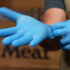 Walton's 5 Mil Blue Nitrile Gloves in use