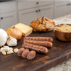 Life style image of Brats on a cutting board made fresh with French Onion Brat Seasoning